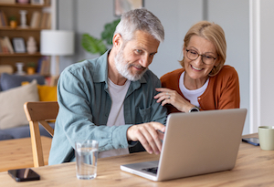 Man and woman on a laptop