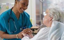 A nurse comforting a patient