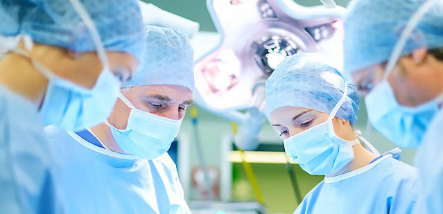 Doctors and nurses performing surgery